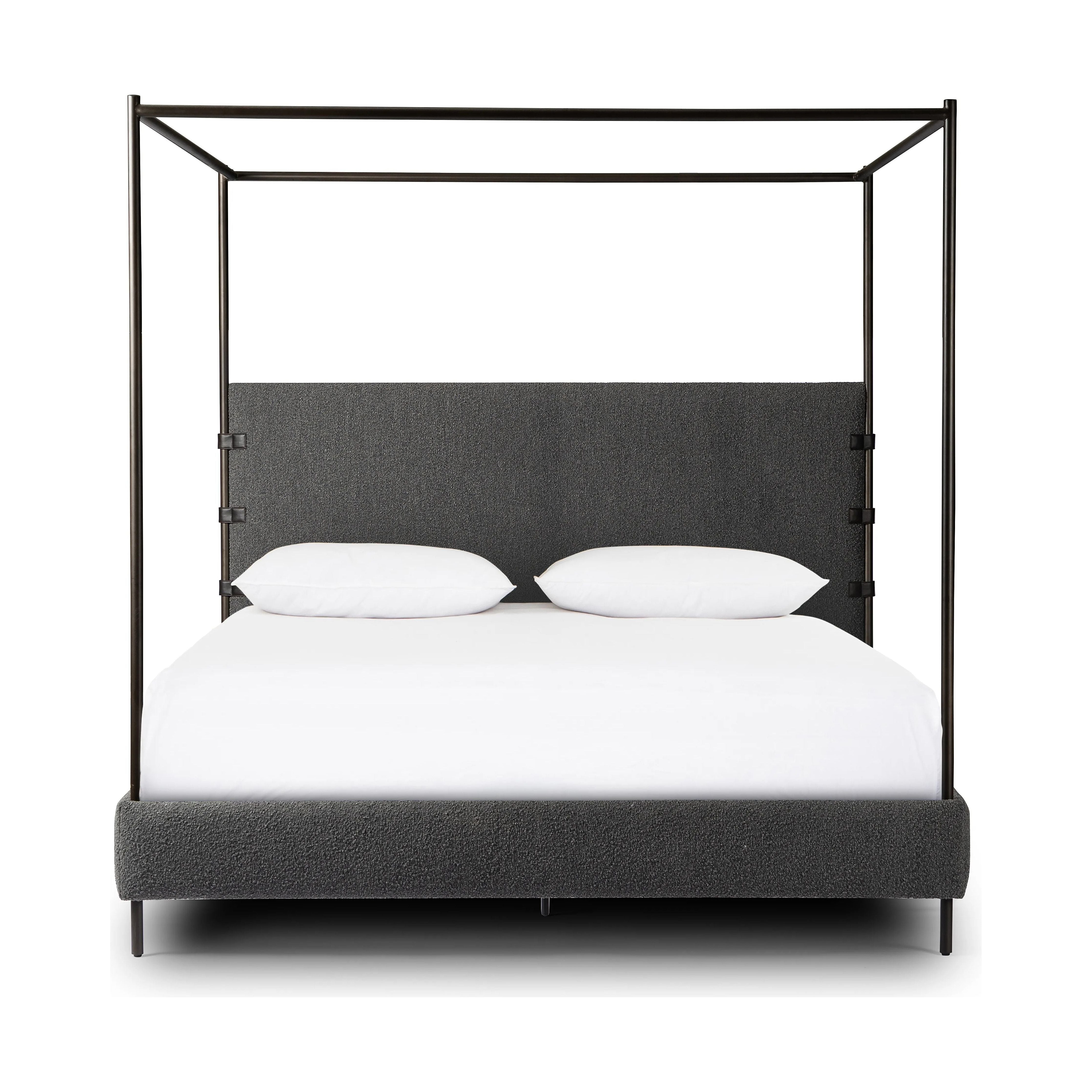 Bring texture into play. This iron canopy bed features a headboard upholstered in a classic boucle fabric with decorative leather straps for a material-driven contrast. Standard box spring required. This bed is not compatible with an adjustable mattress.Collection: Irondal Amethyst Home provides interior design, new home construction design consulting, vintage area rugs, and lighting in the Dallas metro area.