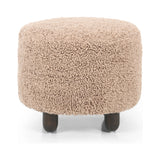 Place this round ottoman just about anywhere. Upholstered in a faux Mongolian shearling with a high pile fur in a toasty tan neutral hue. Burnt birch parawood legs add a touch of contrast.Collection: Kensingto Amethyst Home provides interior design, new home construction design consulting, vintage area rugs, and lighting in the Boston metro area.