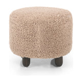 Place this round ottoman just about anywhere. Upholstered in a faux Mongolian shearling with a high pile fur in a toasty tan neutral hue. Burnt birch parawood legs add a touch of contrast.Collection: Kensingto Amethyst Home provides interior design, new home construction design consulting, vintage area rugs, and lighting in the Washington metro area.