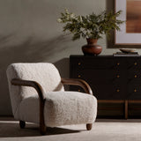 This versatile accent chair is upholstered in a faux Mongolian shearling with a textural high pile. A contrasting, chunky parawood frame hugs the seat and is wire-brushed for a warm, vintage feel. Amethyst Home provides interior design, new construction, custom furniture, and area rugs in the Kansas City metro area.