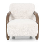 This versatile accent chair is upholstered in a faux Mongolian shearling with a textural high pile. A contrasting, chunky parawood frame hugs the seat and is wire-brushed for a warm, vintage feel. Amethyst Home provides interior design, new construction, custom furniture, and area rugs in the Nashville metro area.