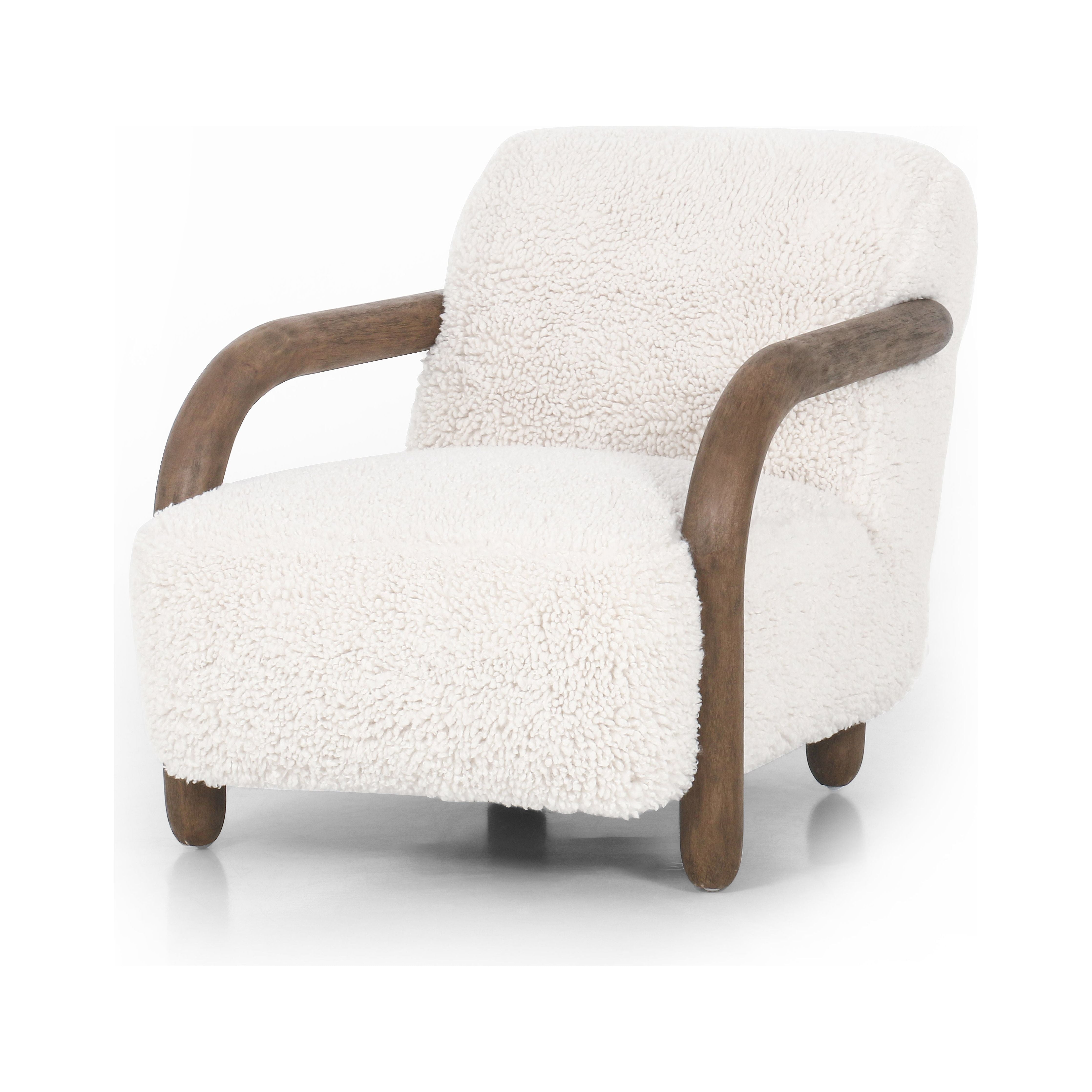 This versatile accent chair is upholstered in a faux Mongolian shearling with a textural high pile. A contrasting, chunky parawood frame hugs the seat and is wire-brushed for a warm, vintage feel. Amethyst Home provides interior design, new construction, custom furniture, and area rugs in the Newport Beach metro area.