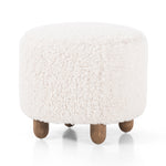 Place this round Aniston Andes Natural Ottoman just about anywhere for a subtle retro vibe. Upholstered in a faux Mongolian shearling with a high pile fur. Parawood legs are wirebrushed for a warm, vintage feel. Amethyst Home provides interior design services, furniture, rugs, and lighting in the Dallas metro area.