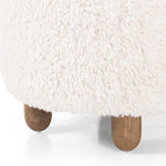 Place this round Aniston Andes Natural Ottoman just about anywhere for a subtle retro vibe. Upholstered in a faux Mongolian shearling with a high pile fur. Parawood legs are wirebrushed for a warm, vintage feel. Amethyst Home provides interior design services, furniture, rugs, and lighting in the Des Moines metro area.