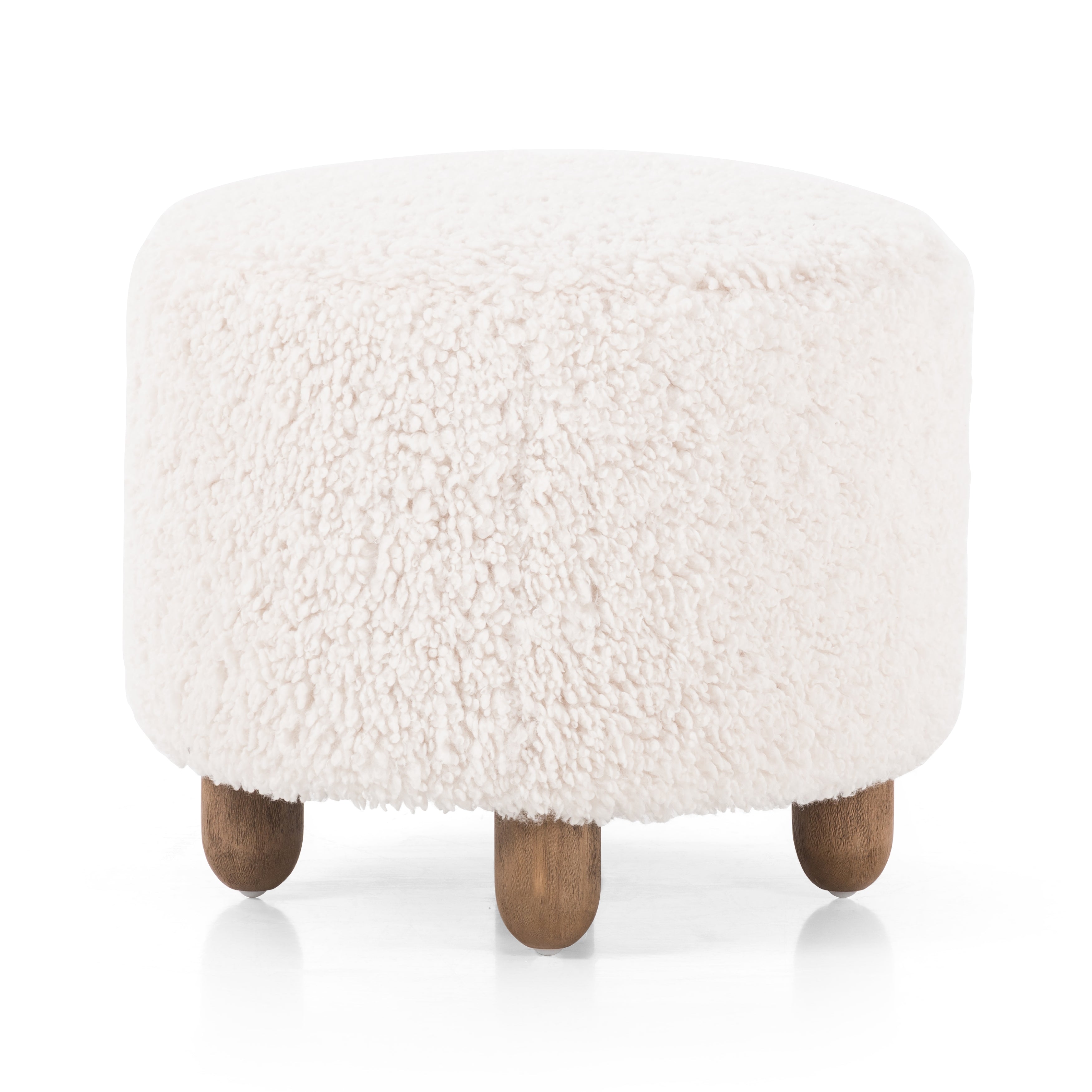 Place this round Aniston Andes Natural Ottoman just about anywhere for a subtle retro vibe. Upholstered in a faux Mongolian shearling with a high pile fur. Parawood legs are wirebrushed for a warm, vintage feel. Amethyst Home provides interior design services, furniture, rugs, and lighting in the Miami metro area.