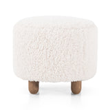 Place this round Aniston Andes Natural Ottoman just about anywhere for a subtle retro vibe. Upholstered in a faux Mongolian shearling with a high pile fur. Parawood legs are wirebrushed for a warm, vintage feel. Amethyst Home provides interior design services, furniture, rugs, and lighting in the Seattle metro area.