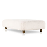 Place this Aniston Andes Natural Rectangle Ottoman just about anywhere for a subtle retro vibe. Upholstered in a faux Mongolian shearling with a high pile fur. Parawood legs are wirebrushed for a warm, vintage feel. Amethyst Home provides interior design services, furniture, rugs, and lighting in the Calabasas metro area.