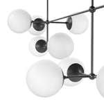 Matte glass spheres seem to extend and reach across smooth brass rods. Each globe is individually blown, shaped and sculpted by hand through a one-hour process. Matte globes are specially manufactured to evenly diffuse light. Amethyst Home provides interior design, new home construction design consulting, vintage area rugs, and lighting in the Park City metro area.