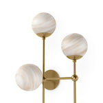 Marbled glass spheres seem to extend and reach across smooth brass rods. Each globe is individually blown, shaped and sculpted by hand through a one-hour process. Brass and glass are 98% recyclable. Designed and sustainably made in Poland by Schwung.Overall Dimensions13.75"w x 13.00"d x 36.25"hFull Details &amp; SpecificationsTear Shee Amethyst Home provides interior design, new home construction design consulting, vintage area rugs, and lighting in the Houston metro area.