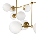 Matte glass spheres seem to extend and reach across smooth brass rods. Each globe is individually blown, shaped and sculpted by hand through a one-hour process. Matte globes are specially manufactured to evenly diffuse light. Brass and glass are 98% recyclable. Designed and sustainably made in Poland by Schwung.Overall Dimensions64.25"w x 30. Amethyst Home provides interior design, new home construction design consulting, vintage area rugs, and lighting in the Houston metro area.