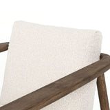 Textural cream boucle seating offers a sumptuous sit, with complementary wire-brushed parawood framing forming a slim U shape. Two posterior top-grain leather straps add a stylish finishing touch. Performance fabrics are specially created to withstand spills, stains, high traffic and wear, ensuring long-term comfort and unmatched durability. Amethyst Home provides interior design, new construction, custom furniture and area rugs in the Scottsdale metro area