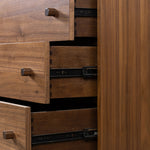 Inspired by campaign-style furniture of the 1800s â€” packable pieces first designed for traveling military use â€” a simply shaped dresser of natural walnut features a subtly inset top and rounded legs, finished with wooden hardware Amethyst Home provides interior design, new home construction design consulting, vintage area rugs, and lighting in the Des Moines metro area.