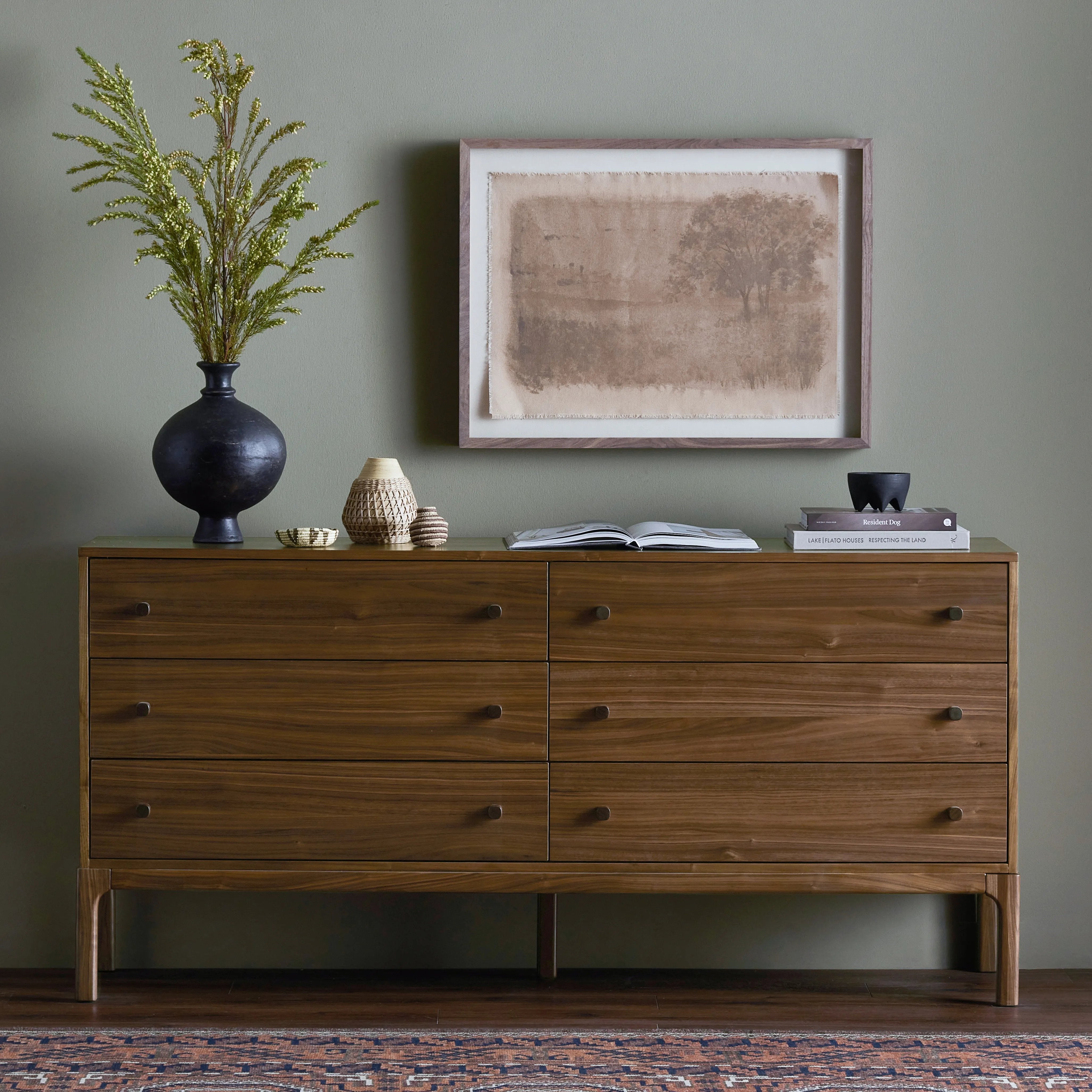 Inspired by campaign-style furniture of the 1800s â€” packable pieces first designed for traveling military use â€” a simply shaped dresser of natural walnut features a subtly inset top and rounded legs, finished with wooden hardware Amethyst Home provides interior design, new home construction design consulting, vintage area rugs, and lighting in the Salt Lake City metro area.