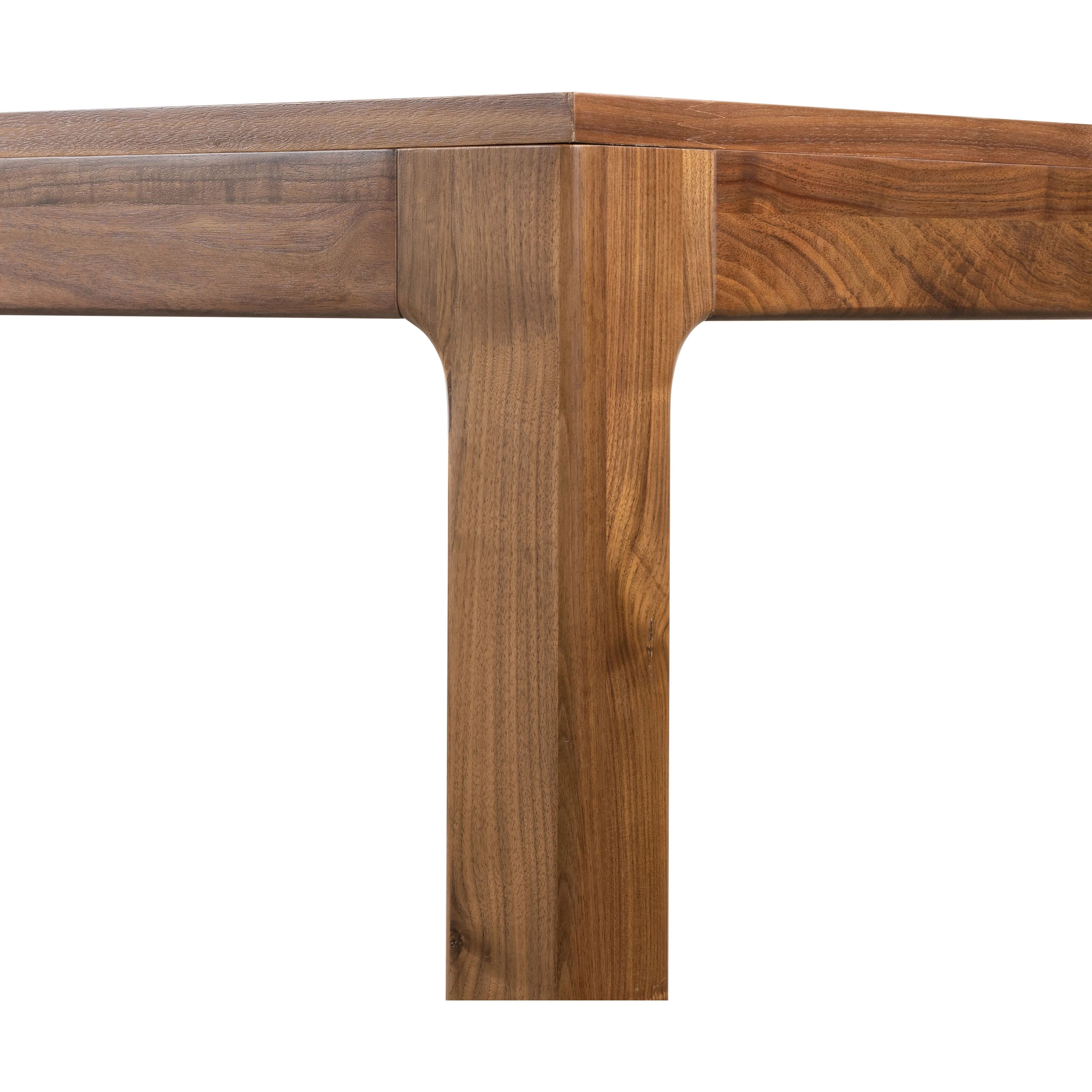 Inspired by campaign-style furniture of the 1800s â€” packable pieces first designed for traveling military use â€” a simply shaped dining table of natural walnut features a subtly inset top and rounded legs Amethyst Home provides interior design, new home construction design consulting, vintage area rugs, and lighting in the Laguna Beach metro area.