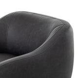 This elevated arm chair features a clean top piece that partially overlaps its bottom counterpart and seamlesssly blends the back cushion into the armrests in one fluid form. The seat's legs appear to extend from the seat and back, adding architectural interest. Amethyst Home provides interior design, new home construction design consulting, vintage area rugs, and lighting in the Houston metro area.