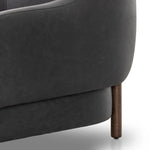 This elevated arm chair features a clean top piece that partially overlaps its bottom counterpart and seamlesssly blends the back cushion into the armrests in one fluid form. The seat's legs appear to extend from the seat and back, adding architectural interest. Amethyst Home provides interior design, new home construction design consulting, vintage area rugs, and lighting in the Miami metro area.