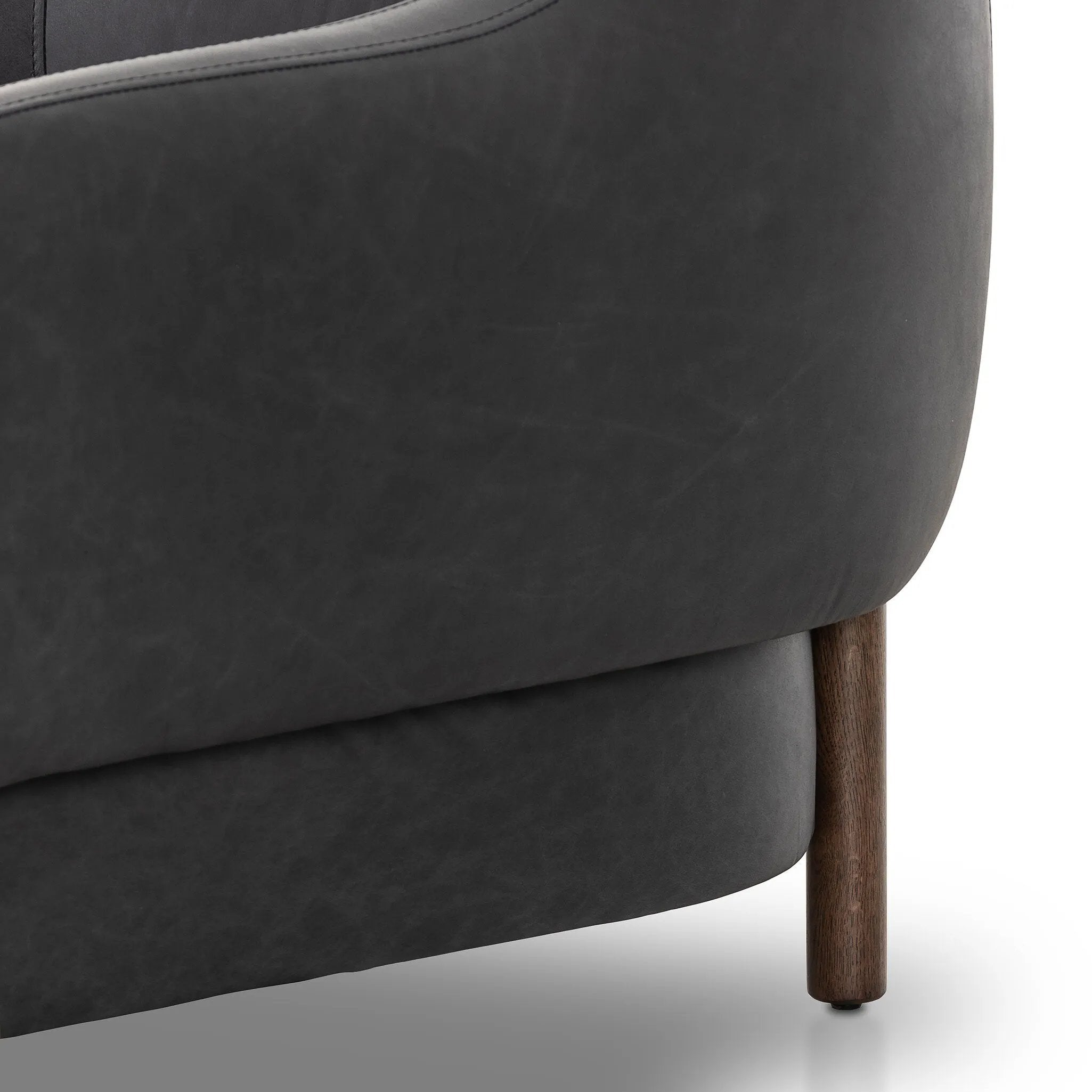 This elevated arm chair features a clean top piece that partially overlaps its bottom counterpart and seamlesssly blends the back cushion into the armrests in one fluid form. The seat's legs appear to extend from the seat and back, adding architectural interest. Amethyst Home provides interior design, new home construction design consulting, vintage area rugs, and lighting in the Miami metro area.