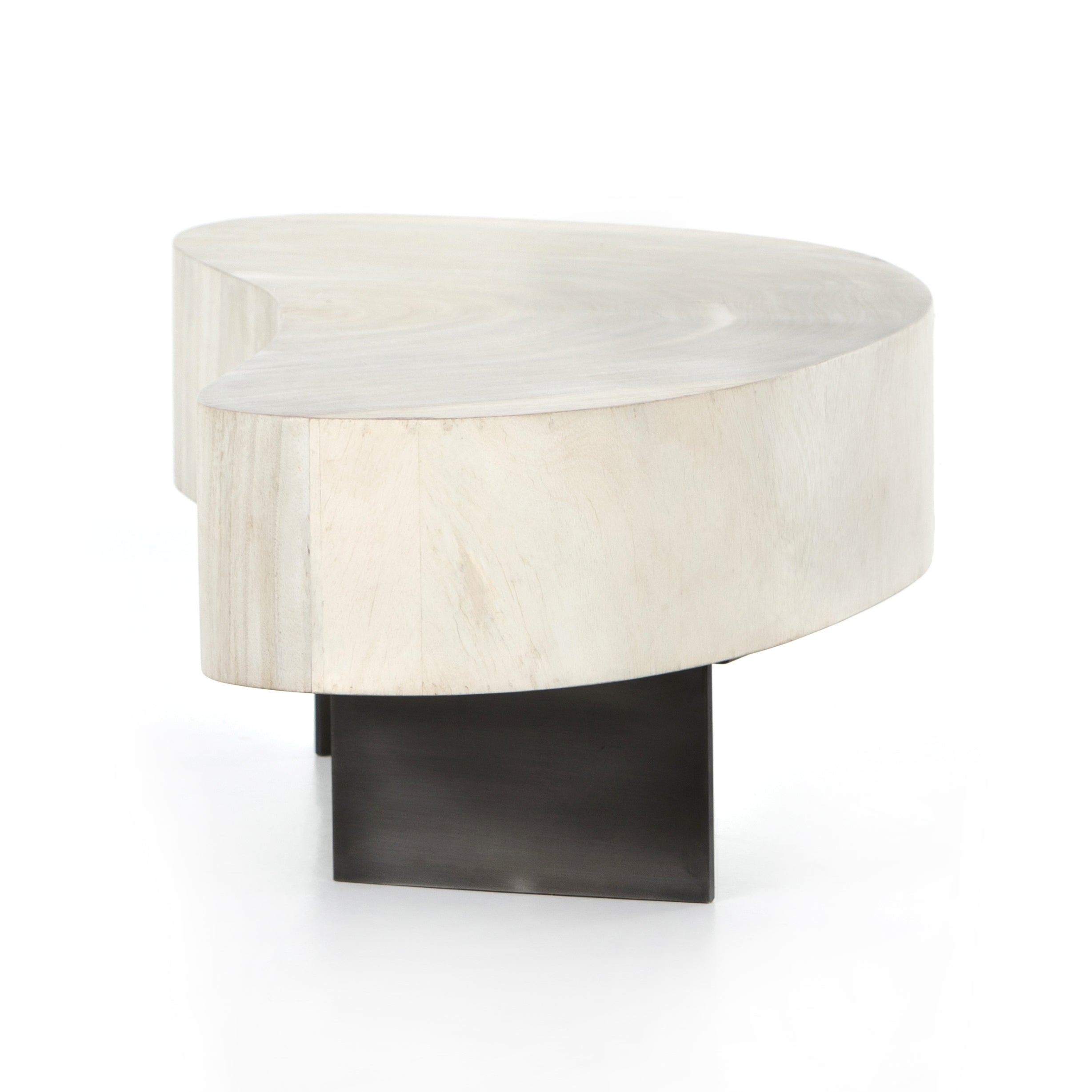 Natural beauty - total novelty. A thick slab of bleached, oyster-cut Guanacaste forms a tall, kidney-shaped coffee table. Visible rings speak to woods' natural graining, while a dark gunmetal-finished base provides clean contrast to the whole look. Amethyst Home provides interior design, new construction, custom furniture, and area rugs in the Boston metro area.