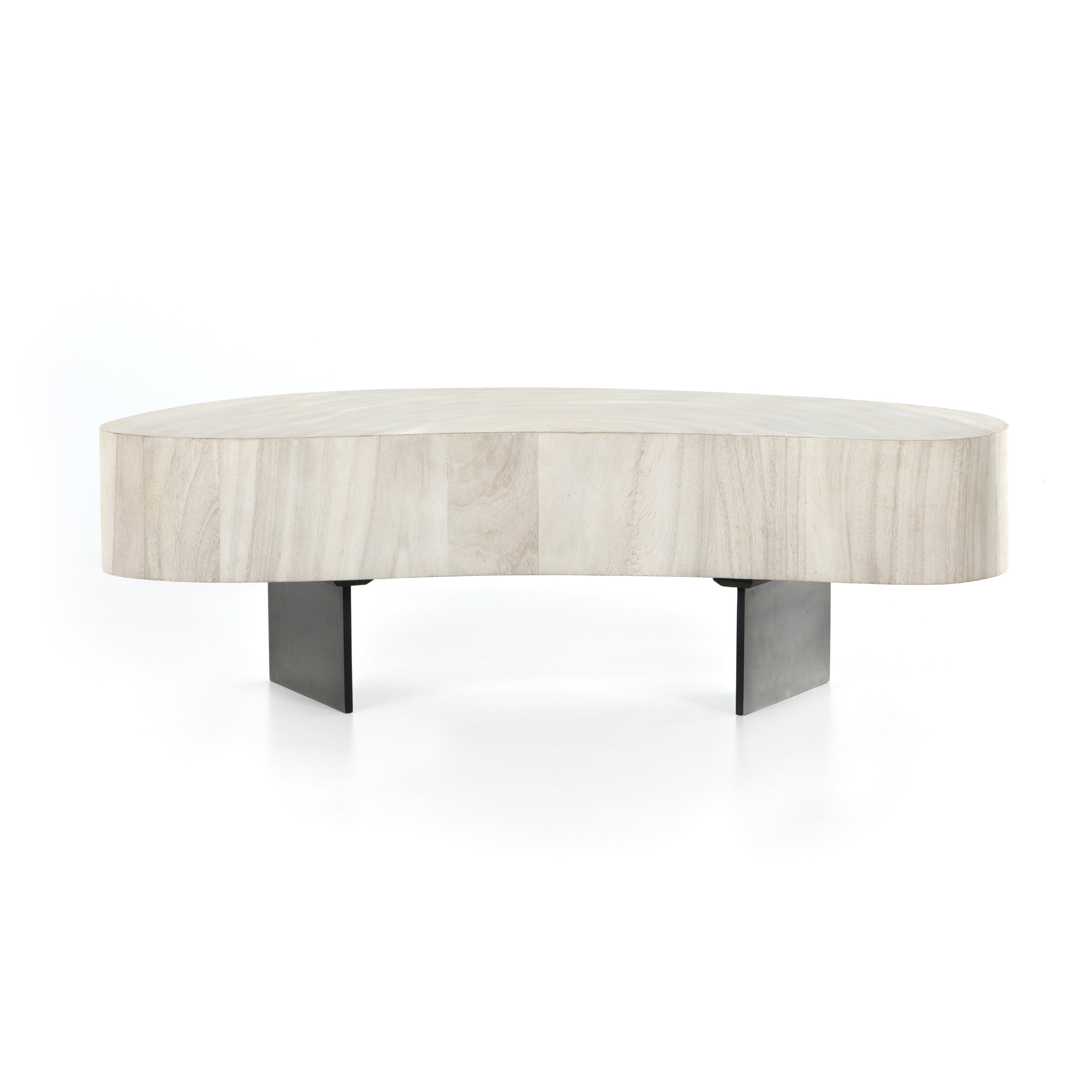 Natural beauty - total novelty. A thick slab of bleached, oyster-cut Guanacaste forms a tall, kidney-shaped coffee table. Visible rings speak to woods' natural graining, while a dark gunmetal-finished base provides clean contrast to the whole look. Amethyst Home provides interior design, new construction, custom furniture, and area rugs in the Nashville metro area.