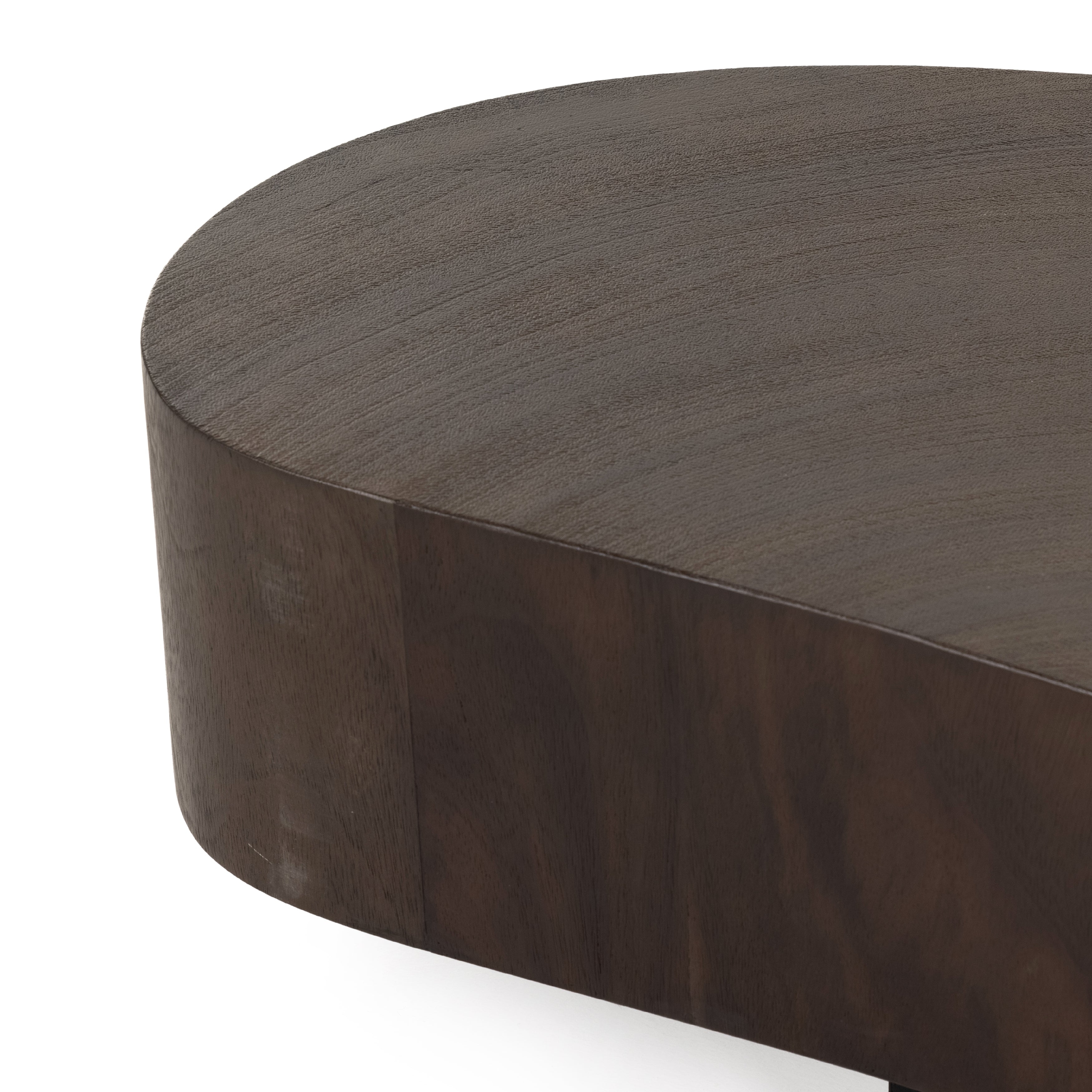 Natural beauty, total novelty. Oyster-cut Guanacaste forms a petite, kidney-shaped coffee table. Visible rings speak to woods' natural graining, while a dark gunmetal-finished base provides clean contrast to the whole look. Option to pair with taller piece, sold separately. Amethyst Home provides interior design, new construction, custom furniture, and area rugs in the Boston metro area.
