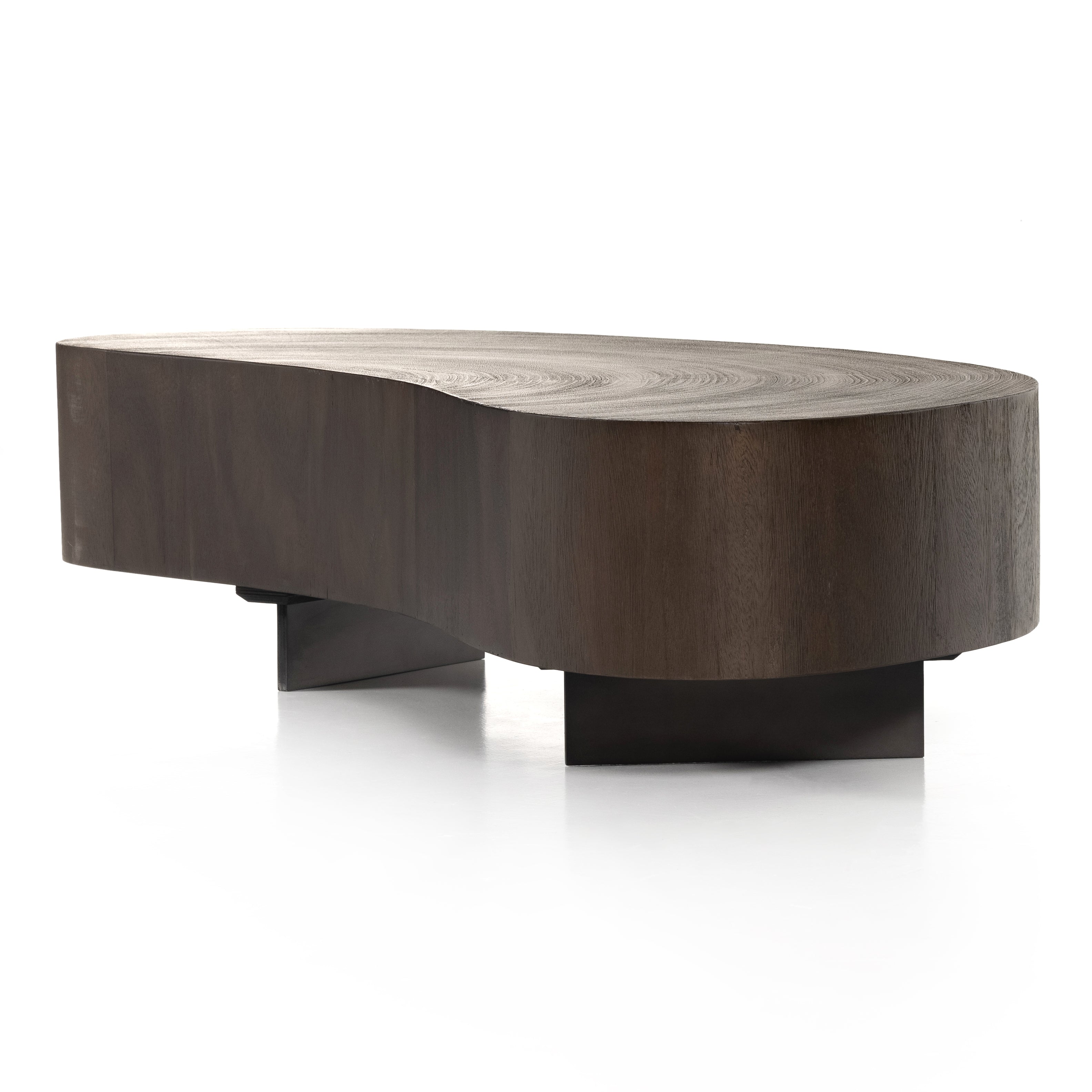 Natural beauty, total novelty. Oyster-cut Guanacaste forms a petite, kidney-shaped coffee table. Visible rings speak to woods' natural graining, while a dark gunmetal-finished base provides clean contrast to the whole look. Option to pair with taller piece, sold separately. Amethyst Home provides interior design, new construction, custom furniture, and area rugs in the Dallas metro area.