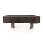Natural beauty. Total novelty. A thick slab of oyster-cut Guanacaste forms a tall, kidney-shaped coffee table. Visible rings speak to woods' natural graining, with a dark gunmetal-finished base below. Amethyst Home provides interior design, new construction, custom furniture, and area rugs in the Charlotte metro area.