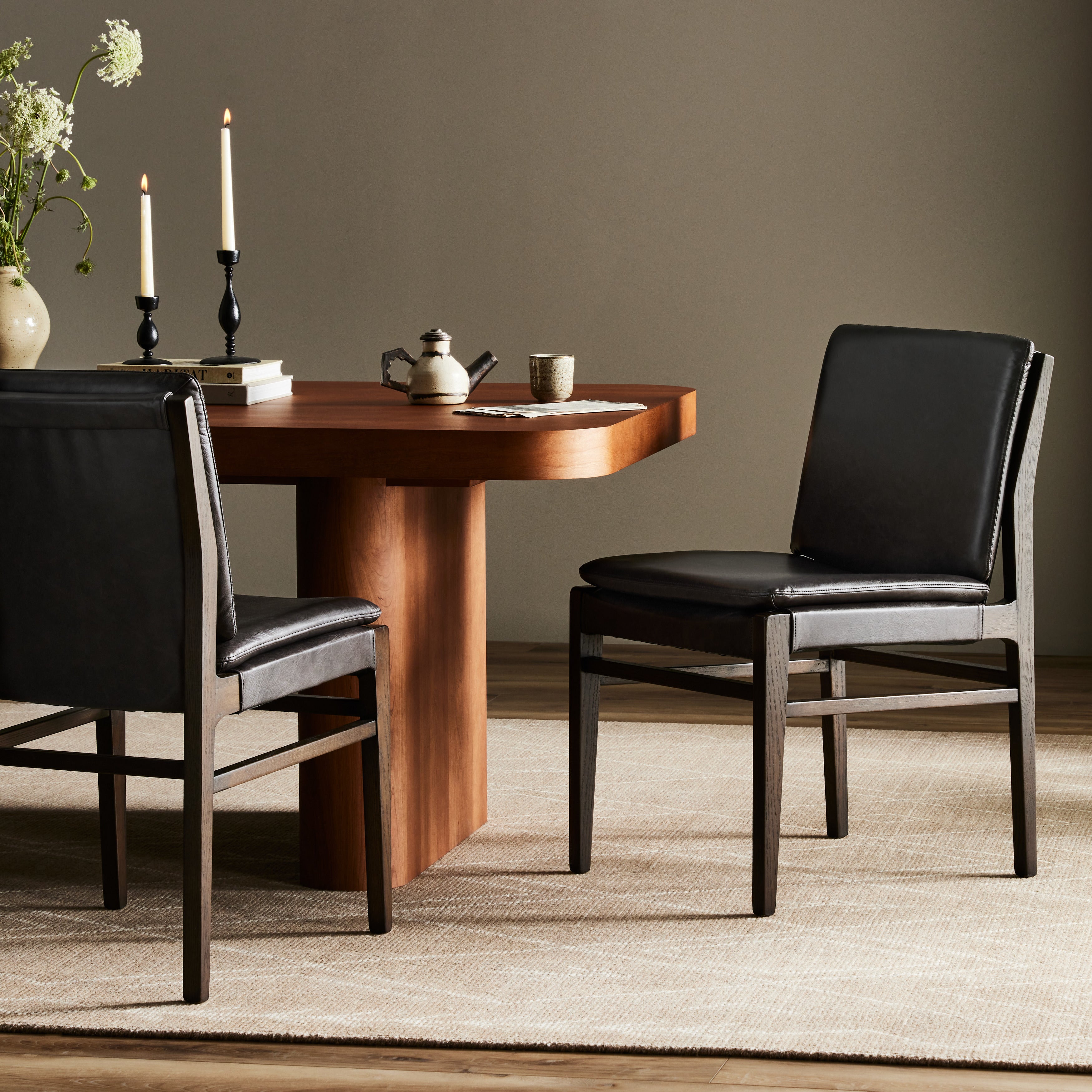 Modern and transitional, burnt oak nettlewood frames this armless dining chair. Finished with a top-grain leather exclusive to Four Hands. Amethyst Home provides interior design, new construction, custom furniture, and area rugs in the Alpharetta metro area.