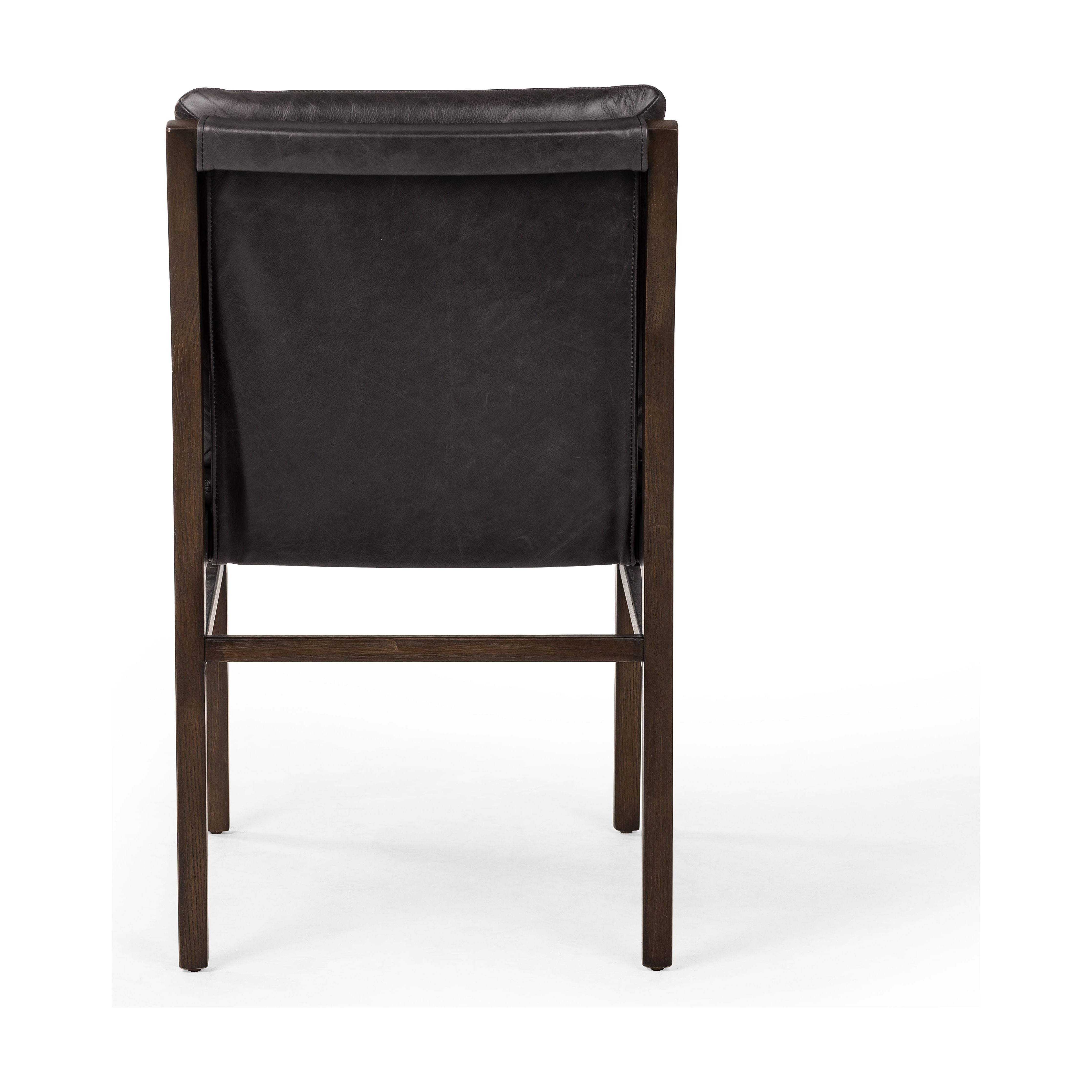 Modern and transitional, burnt oak nettlewood frames this armless dining chair. Finished with a top-grain leather exclusive to Four Hands. Amethyst Home provides interior design, new construction, custom furniture, and area rugs in the Seattle metro area.
