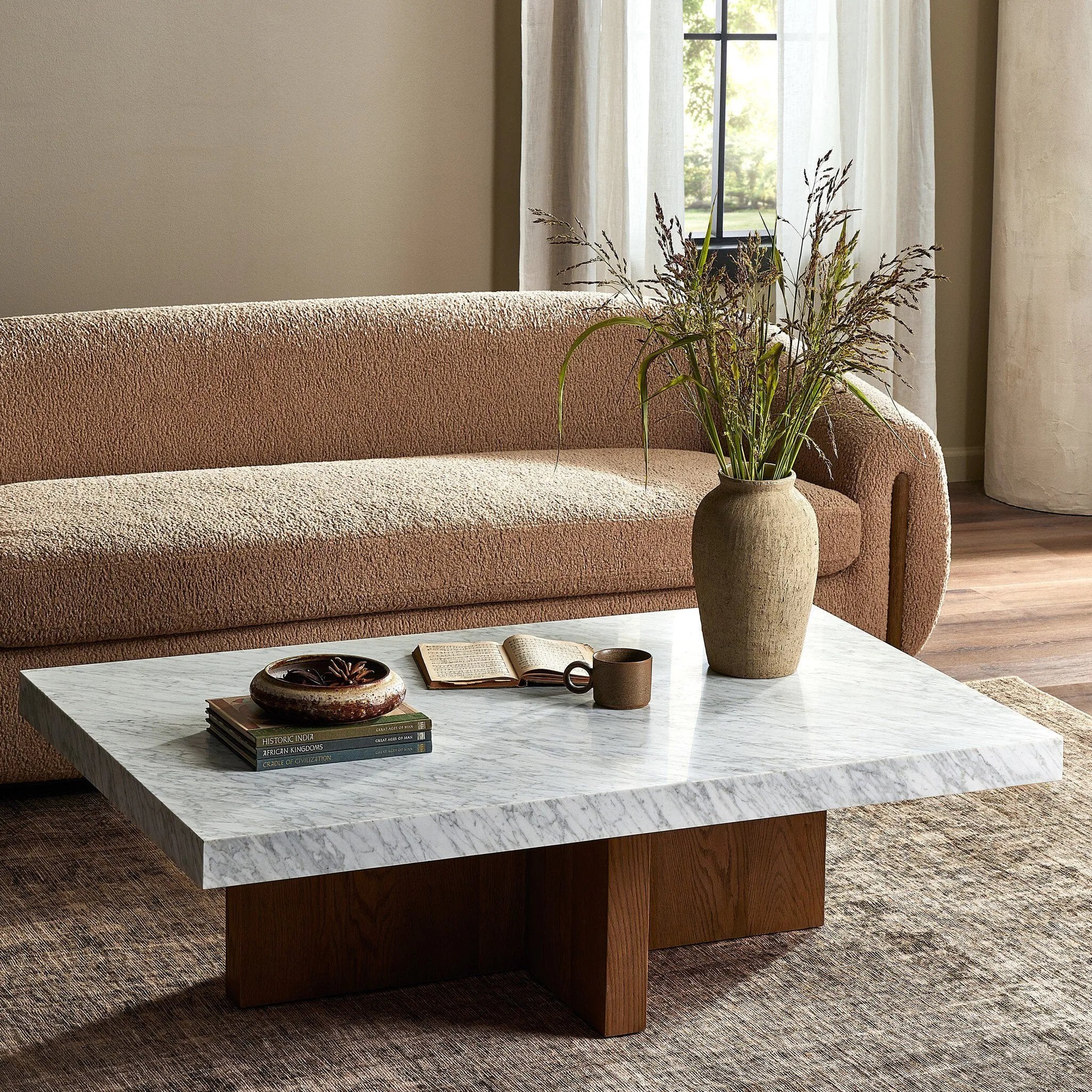 Structured lines and wide proportions fuse for a mixed material coffee table of smoked oak and polished marble.Collection: Hughe Amethyst Home provides interior design, new home construction design consulting, vintage area rugs, and lighting in the Salt Lake City metro area.