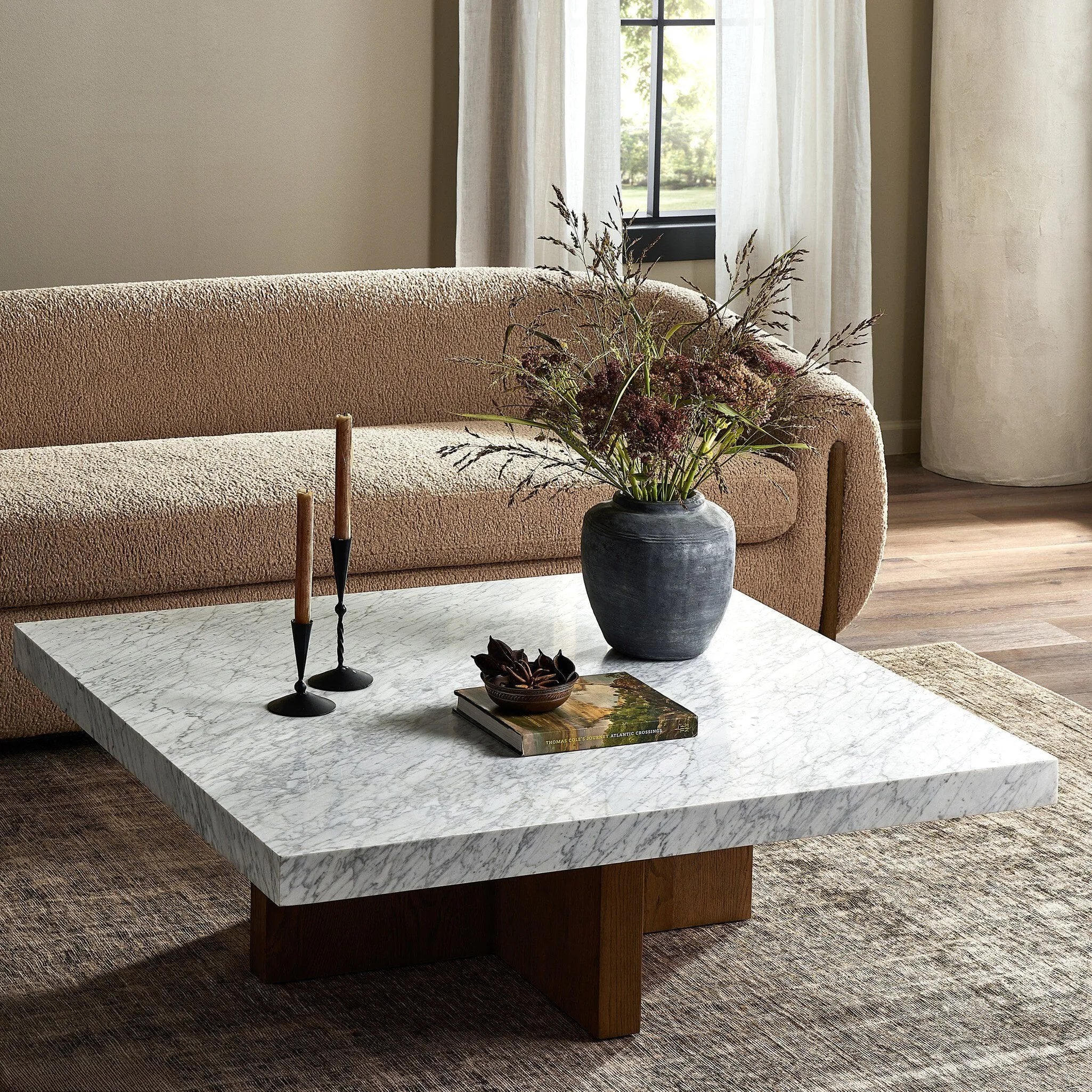 Structured lines and wide proportions fuse for a mixed material coffee table of smoked oak and polished marble.Collection: Hughe Amethyst Home provides interior design, new home construction design consulting, vintage area rugs, and lighting in the Monterey metro area.