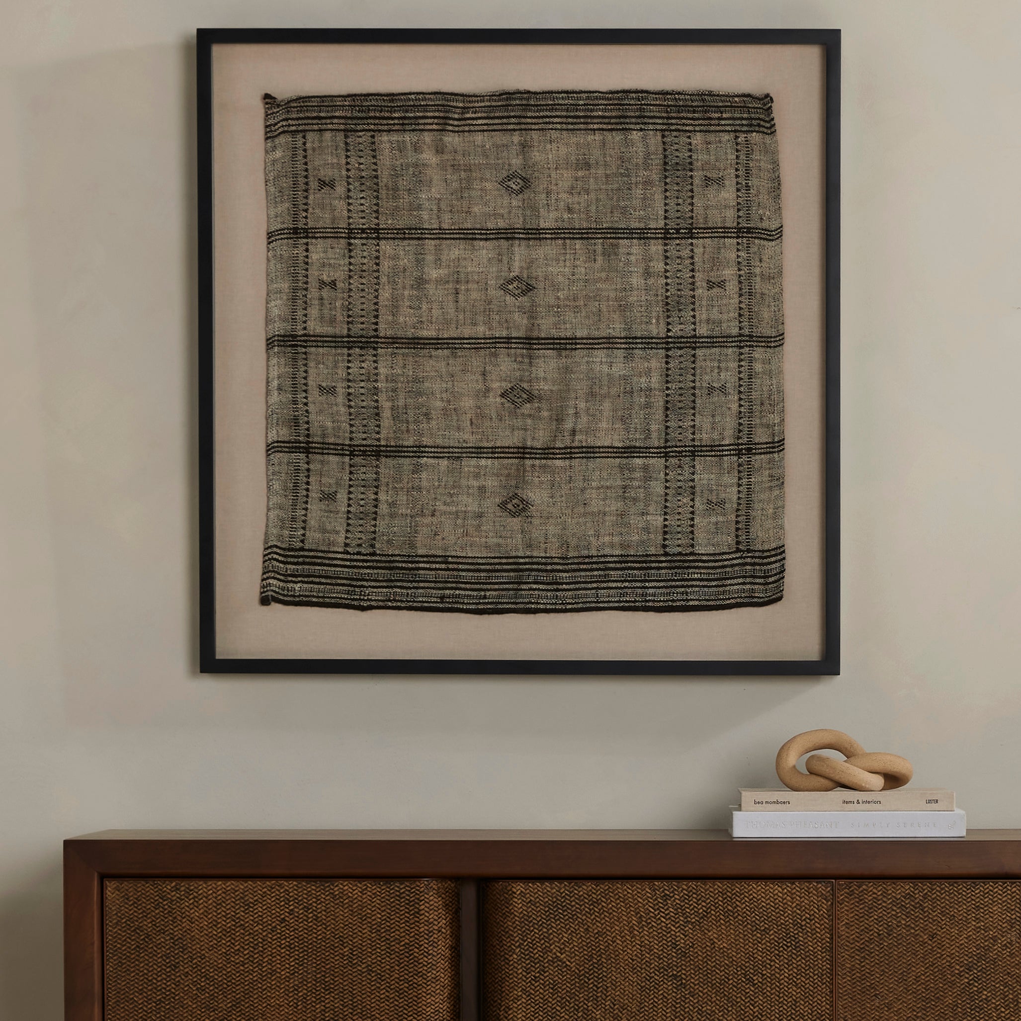 A 500-year-old tradition comes to life on this 100% wool, handwoven textile. Crafted on a traditional frame loom following a tradition created by the Vankars of the Bhujodi village in India, a process that can take up to two days to complete. Finished with fringe tassels on both ends. If not currently in stock, this piece ships within three weeks. Amethyst Home provides interior design, new home construction design consulting, vintage area rugs, and lighting in the Houston metro area.