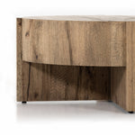 An organic-spirited statement piece. A drum-style coffee table of character-rich oak and veneers rests within a sculptural cradle base of matching rustic oak with beautiful highs and lows. Amethyst Home provides interior design, new construction, custom furniture, and area rugs in the Charlotte metro area.