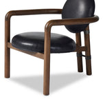Featuring Bria Heirloom Black Chair by Four Hands at Amethyst Home. A playful take on Italian modernism. Solid parawood crafts a slim, curved frame and rear mock-tripod. Upholstered in black top-grain leather. Sourced from one of the oldest family-owned tanneries in Italy’s Bassano del Grappa, our heirloom leather covering is salvaged and processed from up. Amethyst Home provides interior design, new home construction design consulting, vintage area rugs, and lighting in the Alpharetta metro area.