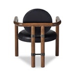 Featuring Bria Heirloom Black Chair by Four Hands at Amethyst Home. A playful take on Italian modernism. Solid parawood crafts a slim, curved frame and rear mock-tripod. Upholstered in black top-grain leather. Sourced from one of the oldest family-owned tanneries in Italy’s Bassano del Grappa, our heirloom leather covering is salvaged and processed from upcycle. Amethyst Home provides interior design, new home construction design consulting, vintage area rugs, and lighting in the Omaha metro area.