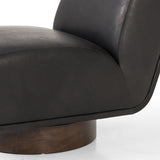 A stylish play on function. In heirloom black top-grain leather, armless accent seating tops a parawood 360-degree swivel base, wire-brushed for vintage vibes. Option to pair with matching side table, which can be fastened or removed from either side with ease. Amethyst Home provides interior design, new construction, custom furniture, and area rugs in the Alpharetta metro area.