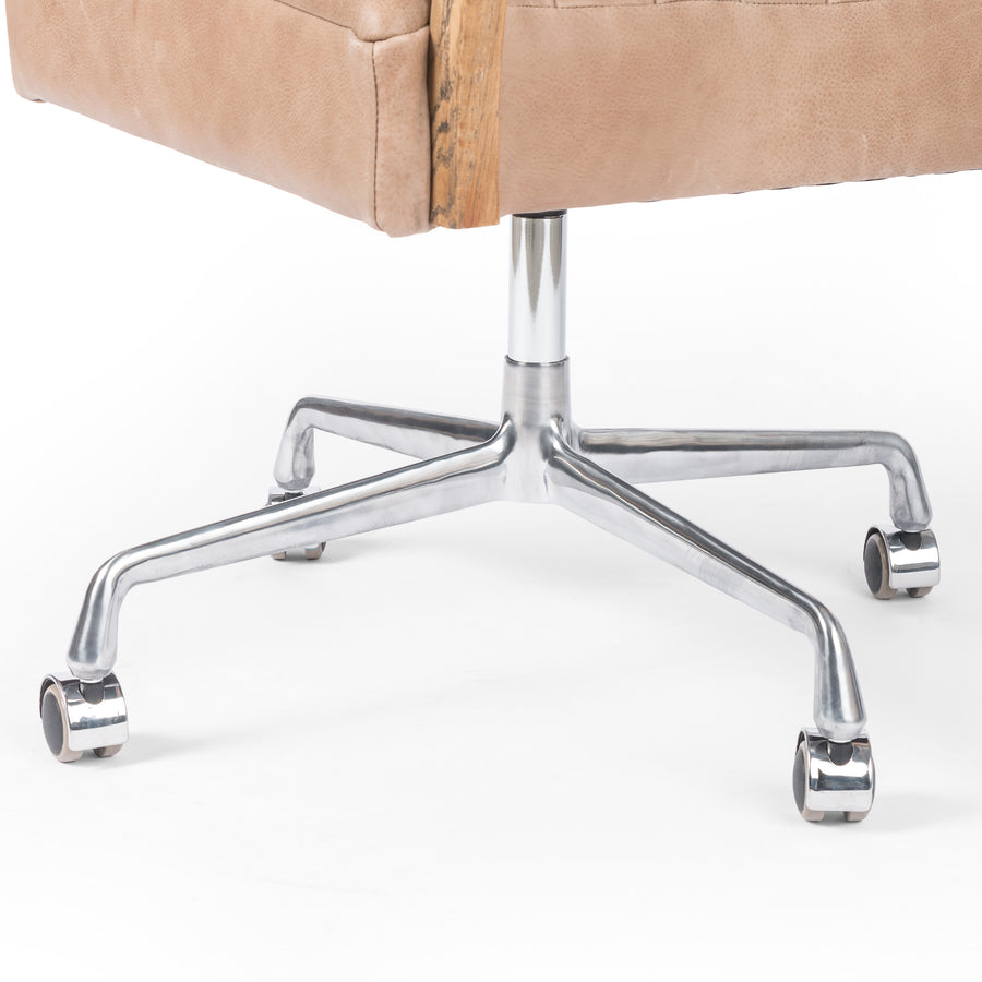 Light tan top-grain leather covers a sculpted seat and back, with elegantly arched arms of solid oak. Stainless steel casters make for ease in the modern workplace. Amethyst Home provides interior design services, furniture, rugs, and lighting in the Calabasas metro area.