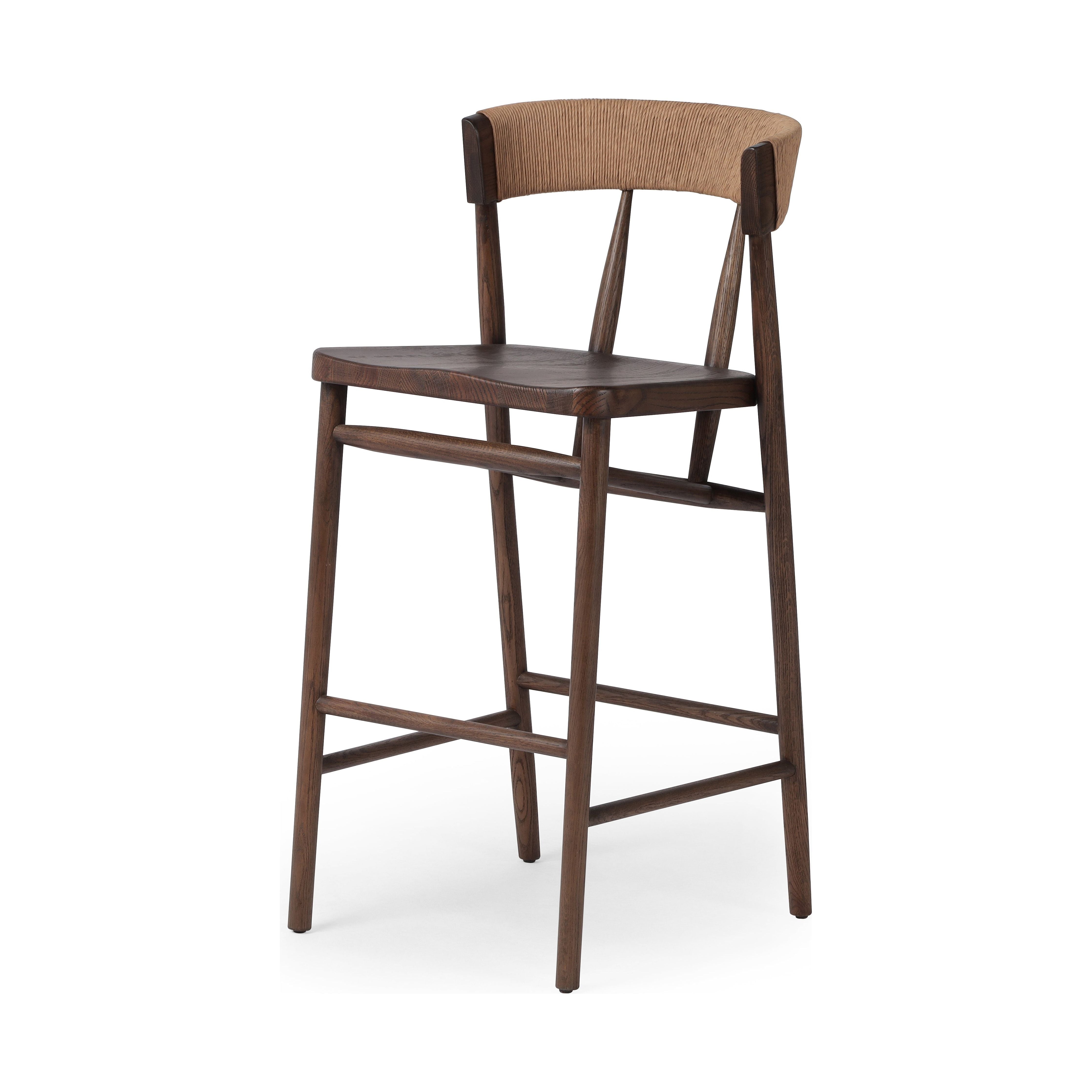 A solid oak bar stool defined by tapered legs and framing gives an updated look to the classic whistler chair. Finished with a paper rush wrapped detail on the back. Amethyst Home provides interior design, new construction, custom furniture, and area rugs in the Seattle metro area.