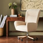 An executive-style chair is upholstered in a high-performance fabric, with subtle curves for a dramatic look and comfortable sit. Casters and seat heigh adjustability for ease in the modern office. Amethyst Home provides interior design, new construction, custom furniture, and area rugs in the Omaha metro area.