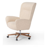 An executive-style chair is upholstered in a high-performance fabric, with subtle curves for a dramatic look and comfortable sit. Casters and seat heigh adjustability for ease in the modern office. Amethyst Home provides interior design, new construction, custom furniture, and area rugs in the Washington metro area.