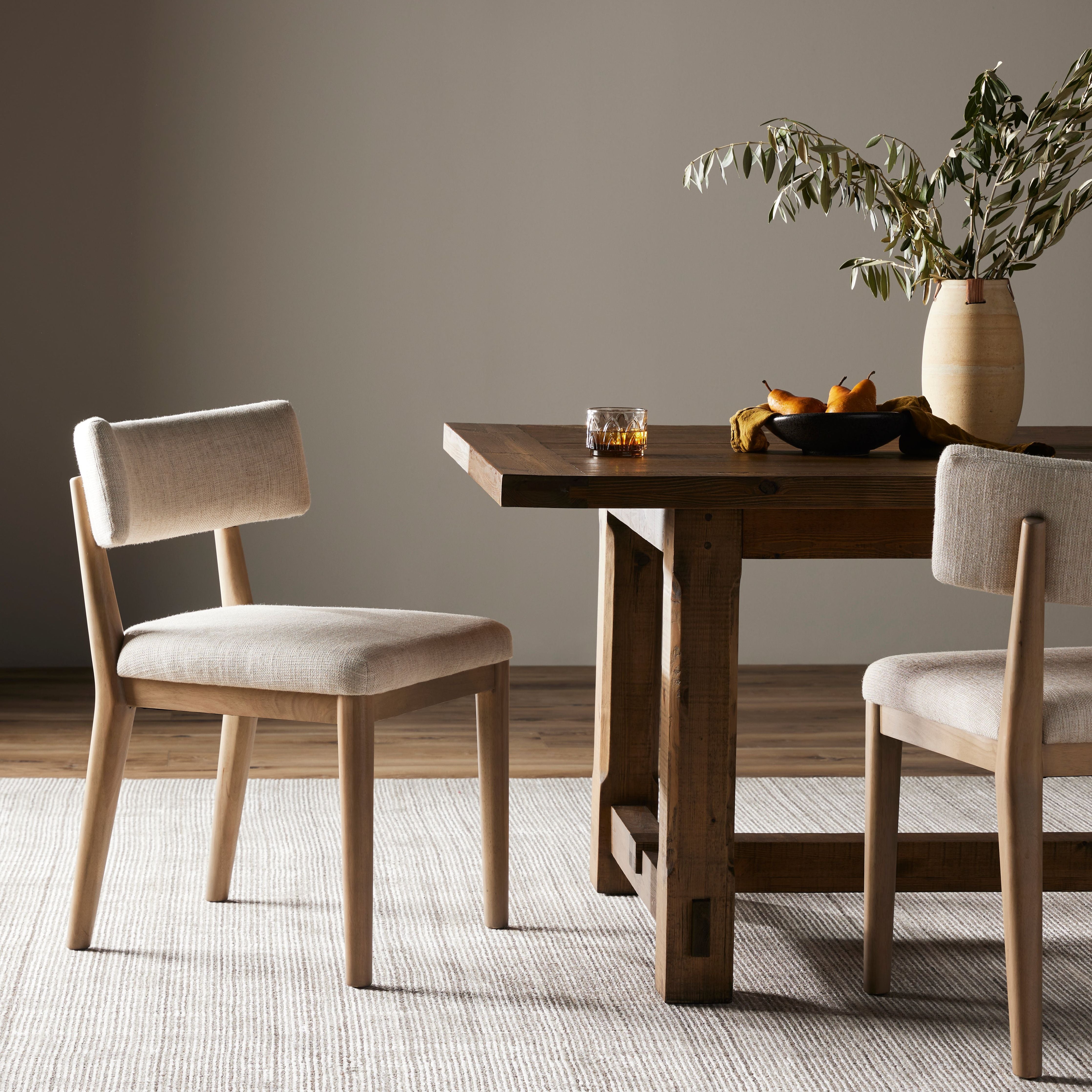 Natural parawood forms a curved barrel back for a shapely take on everyday dining, with textural off-white fabric that moves between styles with ease. Amethyst Home provides interior design, new construction, custom furniture, and area rugs in the Boston metro area.