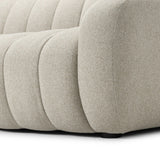Grand in scale and comfort, this plush sofa features wide dramatic channeling for extra volume and a cloud-like look and sit. Covered in a recycled olefin fabric, known for its UV-resistant, water-repellent and quick-drying abilities, in a Turkish weave with a classic tweed feel.Collection: Osl Amethyst Home provides interior design, new home construction design consulting, vintage area rugs, and lighting in the Laguna Beach metro area.