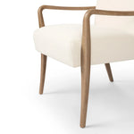 Add timeless midcentury design to your table with this Danish-inspired dining chair. Fluid oak arms and cream upholstery create a chair that embodies both comfort and style.Collection: Ashfor Amethyst Home provides interior design, new home construction design consulting, vintage area rugs, and lighting in the Houston metro area.
