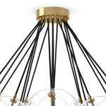 Clear glass bulbs dangle for a statement-making centerpiece. Each globe is individually blown, shaped and sculpted by hand through a one-hour process. Brass and glass are 98% recyclable. Designed and sustainably crafted in Poland by Schwung.Overall Dimensions47.00"w x 47.00"d x 33.50"hFull Details &amp; SpecificationsTear Shee Amethyst Home provides interior design, new home construction design consulting, vintage area rugs, and lighting in the Austin metro area.