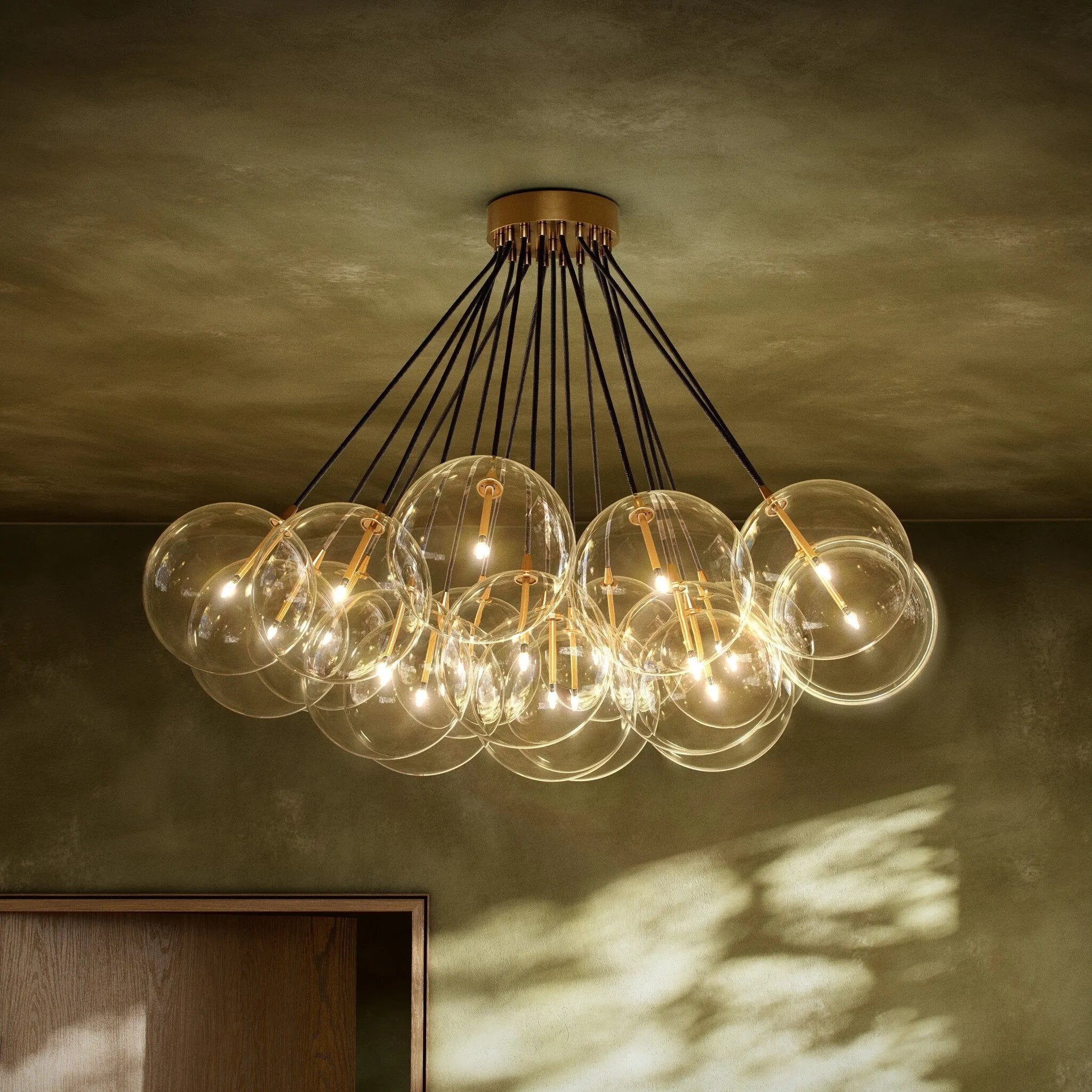 Clear glass bulbs dangle for a statement-making centerpiece. Each globe is individually blown, shaped and sculpted by hand through a one-hour process. Brass and glass are 98% recyclable. Designed and sustainably crafted in Poland by Schwung.Overall Dimensions47.00"w x 47.00"d x 33.50"hFull Details &amp; SpecificationsTear Shee Amethyst Home provides interior design, new home construction design consulting, vintage area rugs, and lighting in the Nashville metro area.