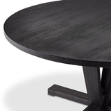 A rounded table of solid mango wood forms purposefully burnished edges, producing a warm black patina for the home dining table. Amethyst Home provides interior design, new construction, custom furniture, and area rugs in the Seattle metro area.