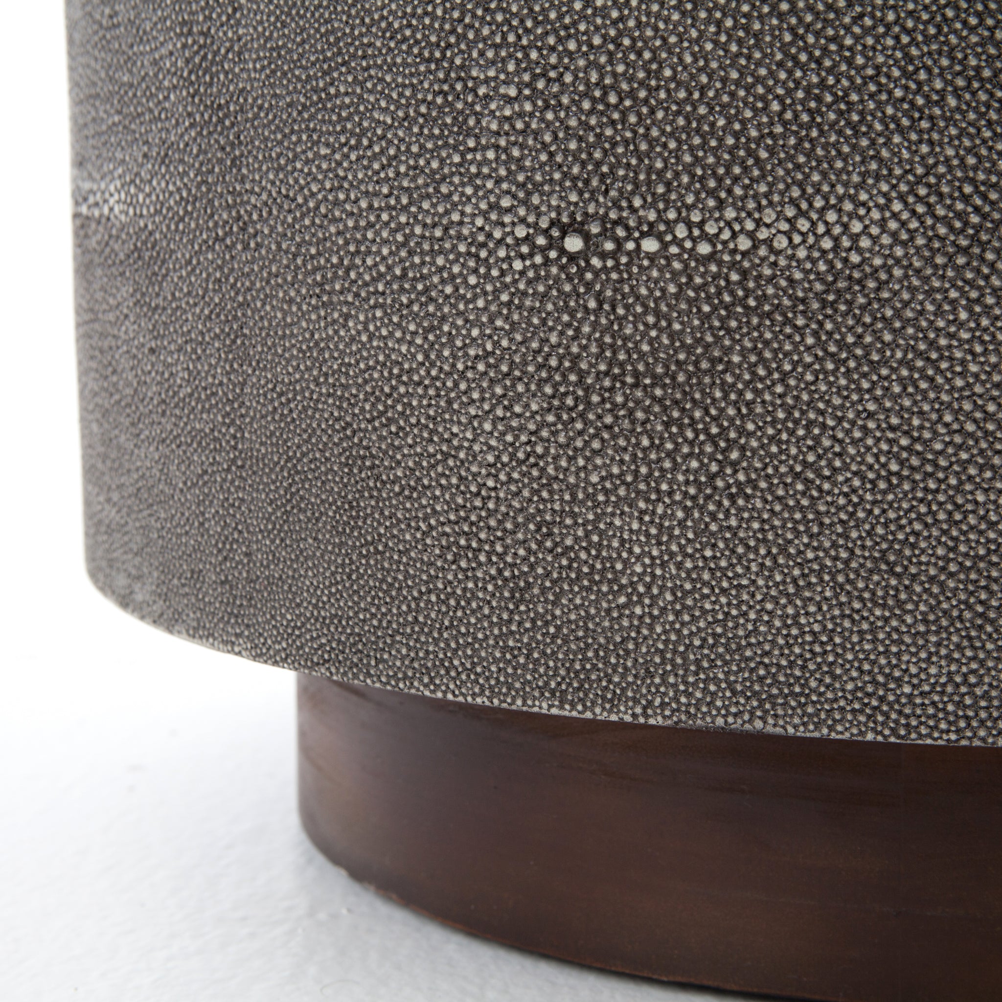 Mixed materials and the simplest of shapes are sized to make a perfect side table. Reclaimed peroba wood is supported by a textural faux shagreen base in soft grey. This piece is designed in collaboration with Thomas Bina. Amethyst Home provides interior design, new construction, custom furniture, and area rugs in the Laguna Beach metro area.