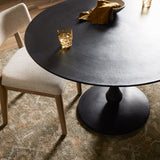 Finished in an antique black, raw aluminum shapes a bistro-style dining table with a turned, geometric look. Seats four comfortably. Amethyst Home provides interior design, new construction, custom furniture, and area rugs in the San Diego metro area.
