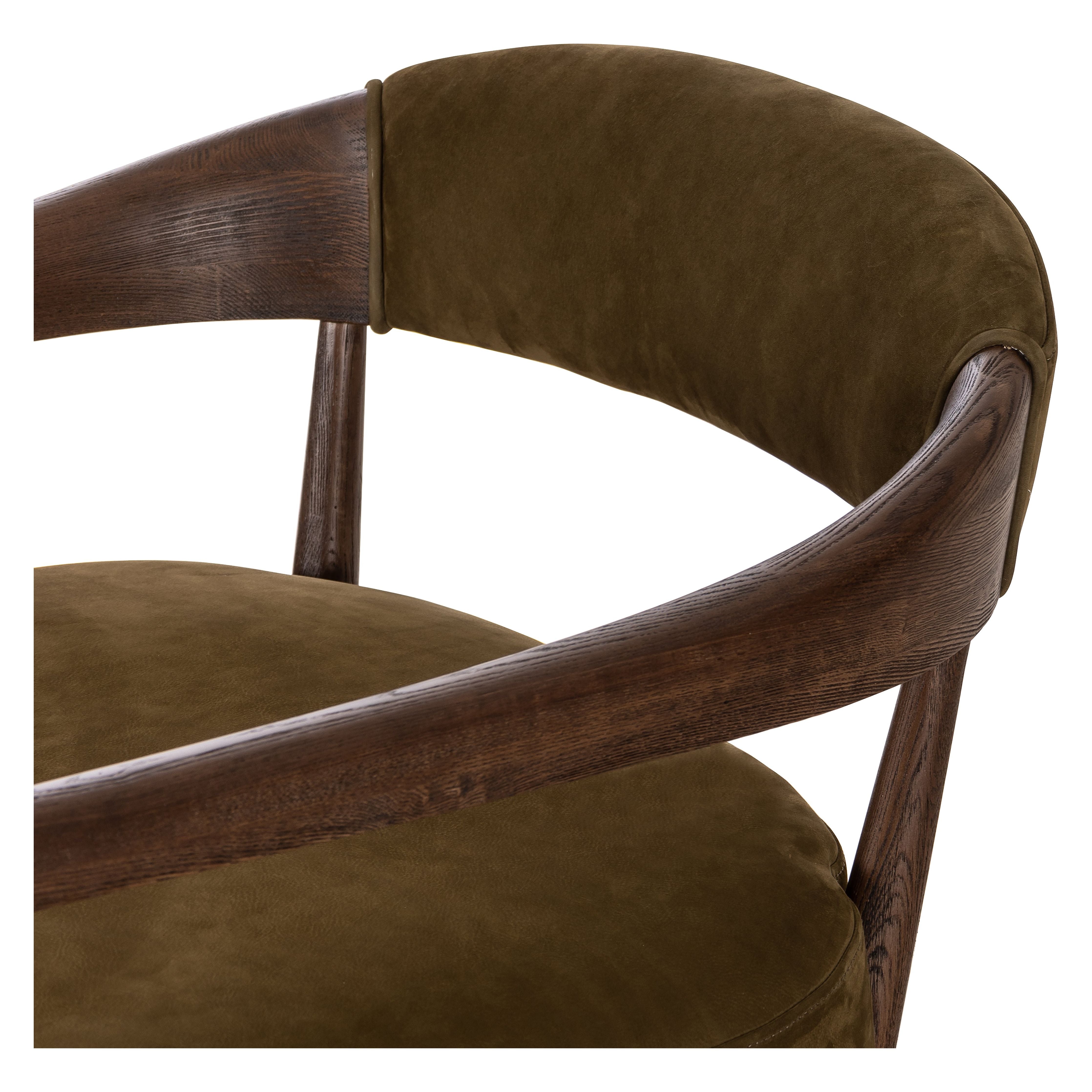 Safari styling is brought to modern speed on this vintage-inspired chair. Its solid wood frame features a webbed seating structure that brings a sink-in feel to the entire piece. The upholstered back, strap details and loose cushion are finished in a rich Italian-made leather with a soft, buttery feel and subtle highs and lows throughout the hide that bring movement to the entire piece. Amethyst Home provides interior design, new construction, custom furniture, and area rugs in the Washington metro area.
