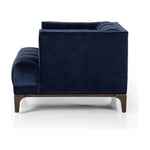 This low, tailored midcentury silhouette is upholstered in a velvety navy fabric, with dramatic blind tufting for texture.Collection: Kensingto Amethyst Home provides interior design, new home construction design consulting, vintage area rugs, and lighting in the Calabasas metro area.