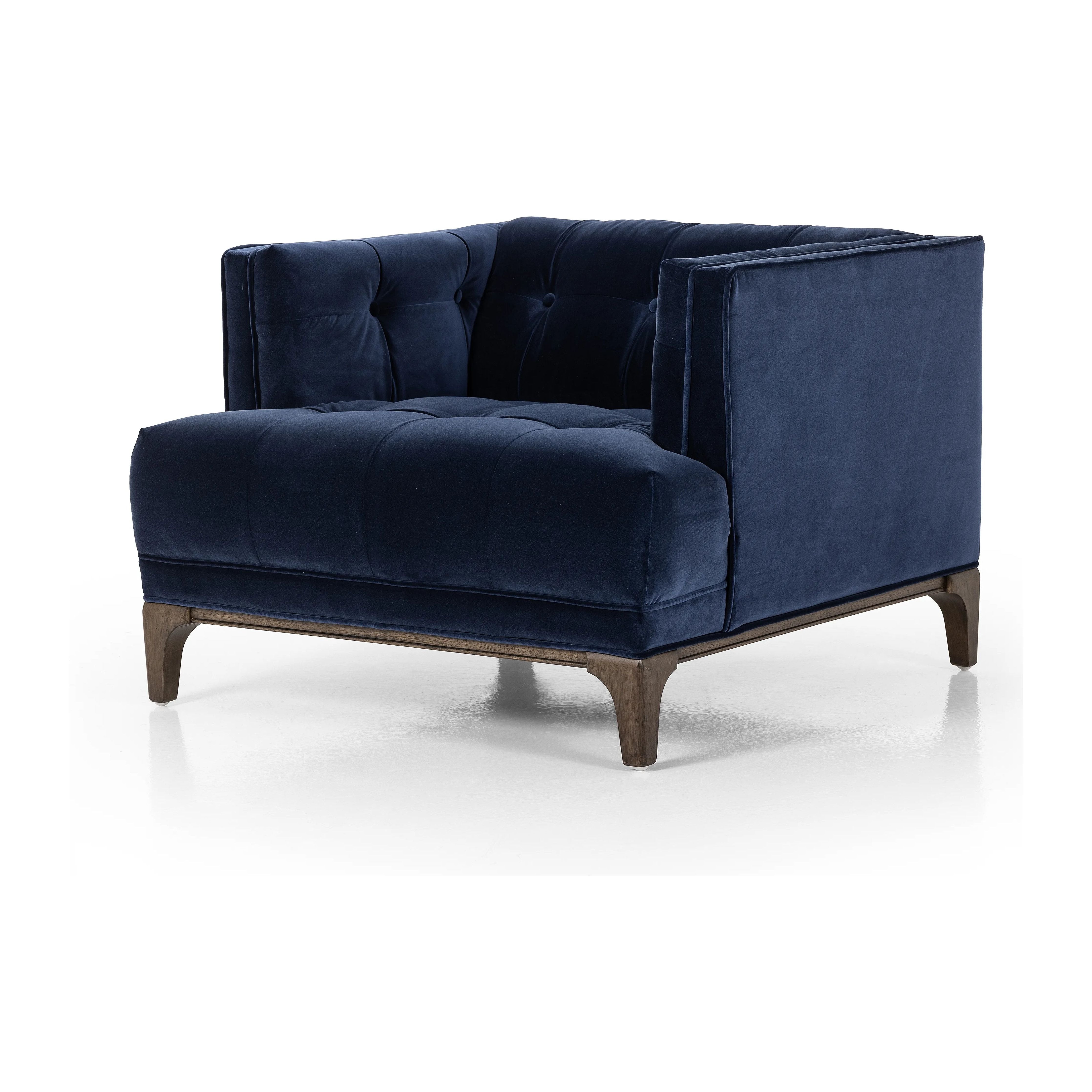 This low, tailored midcentury silhouette is upholstered in a velvety navy fabric, with dramatic blind tufting for texture.Collection: Kensingto Amethyst Home provides interior design, new home construction design consulting, vintage area rugs, and lighting in the Nashville metro area.